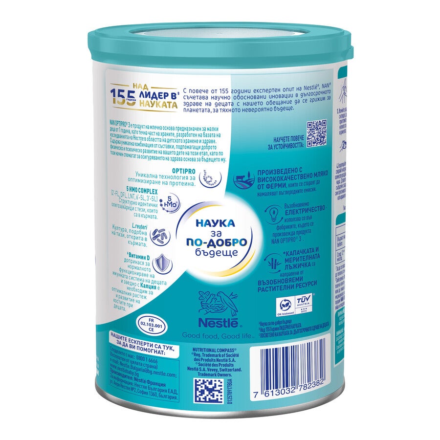 Teal tin of infant formula with nutrition labels, icons, and barcode
