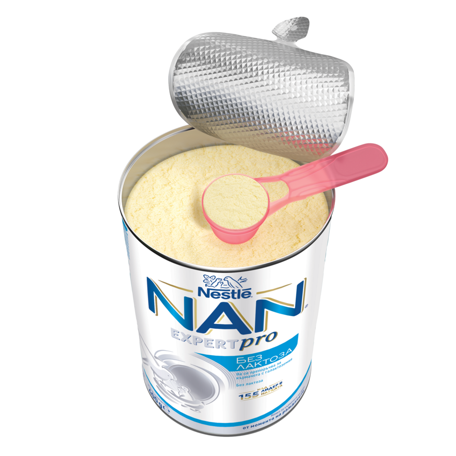 Open can of powdered infant formula with peeled foil lid, pink scoop, NAN logo