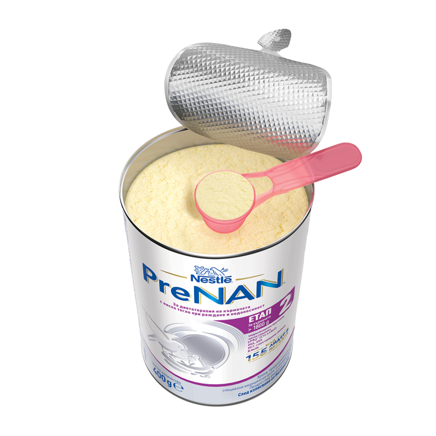 Open can of Nestlé PreNAN baby formula powder with a pink scoop