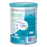 Teal tin of infant formula with nutrition labels, icons, and barcode